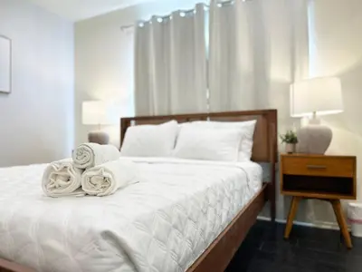 a bedroom with a bed with towels on it at Bohemian Dream- 2BR, Retreat Near Hollywood -BR6 in Los Angeles
