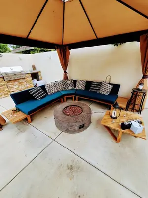 a living room with a couch and an umbrella at Luxury Guesthouse in Los Angeles