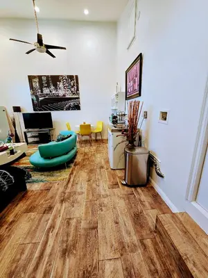 a living room with wooden floors and a ceiling at Luxury Guesthouse in Los Angeles