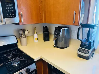 a kitchen counter with a blender on a counter top at Mid-City Charm 2BR Near LAs Hotspots! in Los Angeles