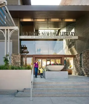 a woman standing in front of a building at Luxury 4 bedroom house Los Angeles in Castaic Junction