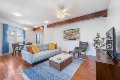 a living room with a couch and a table at Woodland Victory Hideaway in Tarzana