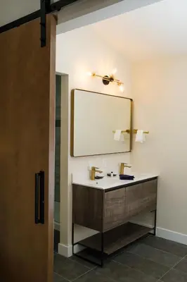 a bathroom with a sink and a mirror at Adobe Inn in Monterey Park