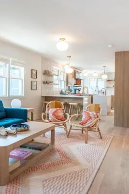 a living room with a blue couch and chairs at Walk to Venice Beach from Luxury home in Los Angeles