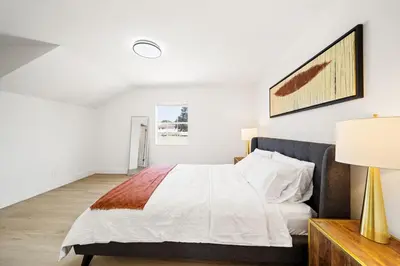 a white bedroom with a bed and a lamp at 2Bedroom home - Marengo Estate in Alhambra