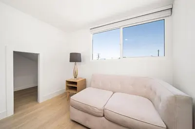 a white living room with a couch and a window at 2Bedroom home - Marengo Estate in Alhambra