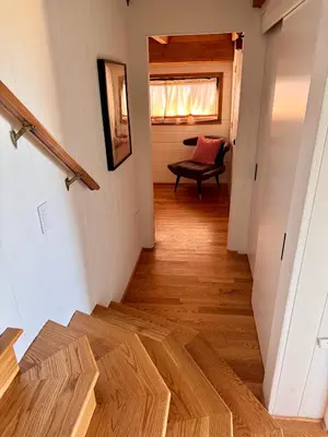 a hallway with wooden floors in a house at Architectural Marvel in Hollywood Hills with Views in Los Angeles