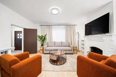 a living room with a couch and a fireplace at 2Bedroom home for your comfort and relaxation in Alhambra