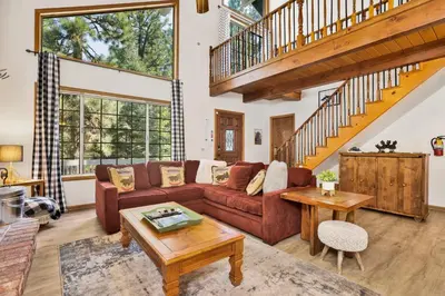 a living room with a couch and a table at Four little bears cabin #2490 in Big Bear Lake