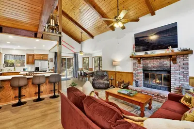 a living room with a couch and a fireplace at Four little bears cabin #2490 in Big Bear Lake
