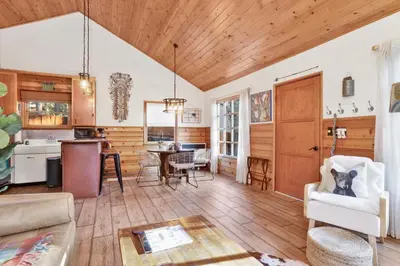 a living room with a kitchen and a dining room at The nest on towne trail #2480 in Big Bear Lake