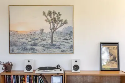 a living room with a picture on the wall at Serene and beautiful hillside retreat in Glendale