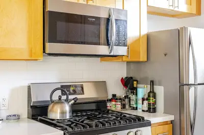 a tea kettle on a stove in a kitchen at Serene and beautiful hillside retreat in Glendale