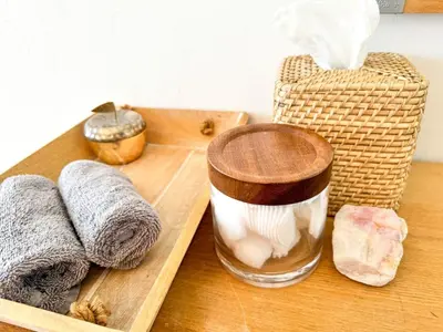 a wooden tray with towels and a container of garlic at Serene and beautiful hillside retreat in Glendale