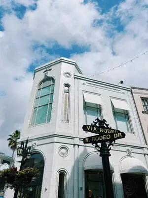 a white building with a sign in front of it at Hollywood CHIC Studio with FREE parking in Los Angeles
