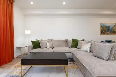 a living room with a couch and a coffee table at Stylish Apartments in Glendale with Free Parking in Glendale