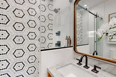 a bathroom with a sink and a mirror at Mickey's Hideaway in Anaheim