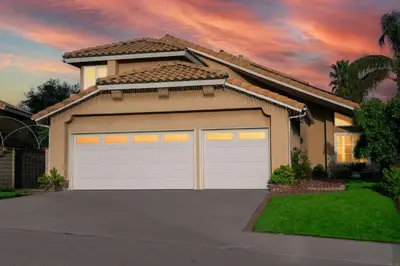 a house with two garage doors in front of it at The Best View in The City! in Castaic