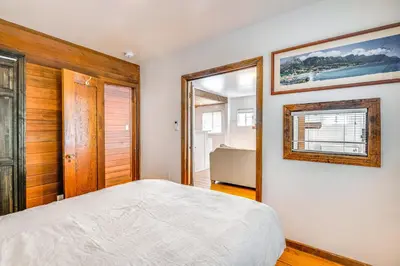 a bedroom with a large bed and a window at Less Than 1 Mi to Venice Beach and Boardwalk! Quiet Cottage in Los Angeles
