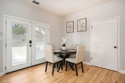 a dining room with a table and chairs at Central Bliss near parks & shops in Bakersfield