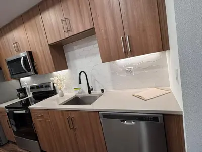 a kitchen with a sink and a stove top oven at Awesome Loft at Hollywood FREE Parking in Los Angeles