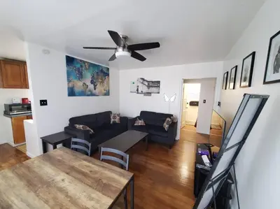 a living room with a couch and a ceiling fan at Hollywood - Budget Private Quiet 2nd Flr 1BR and 1BA in Los Angeles