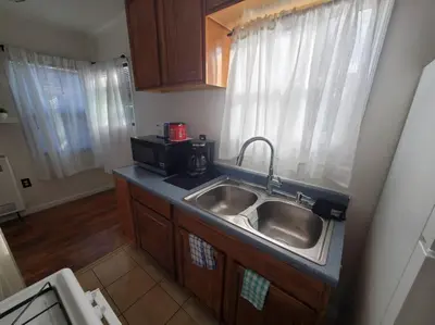 a kitchen with a sink and a microwave at Hollywood - Budget Private Quiet 2nd Flr 1BR and 1BA in Los Angeles