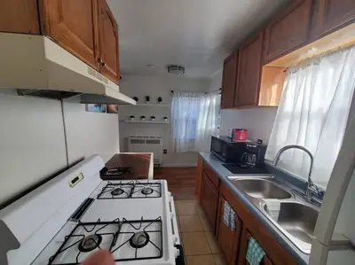 a kitchen with a sink and a stove top oven at Hollywood - Budget Private Quiet 2nd Flr 1BR and 1BA in Los Angeles