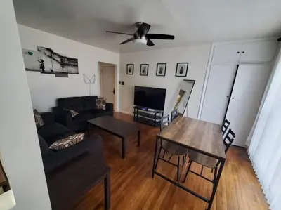 a living room with a couch and a table at Hollywood - Budget Private Quiet 2nd Flr 1BR and 1BA in Los Angeles