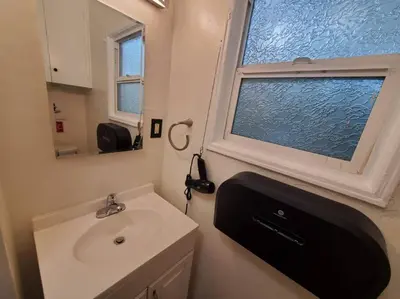 a bathroom with a sink and a window at Hollywood - Budget Private Quiet 2nd Flr 1BR and 1BA in Los Angeles