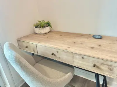 a wooden desk with a potted plant on top of it at Corner 2 Bedroom 2 Bath Condo - Balcony - Parking in Los Angeles