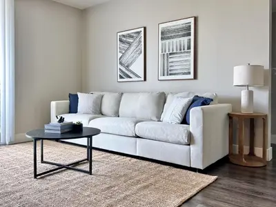 a living room with a white couch and a table at Stunning 2BD 2BTH Apt in Santa Monica! in Los Angeles