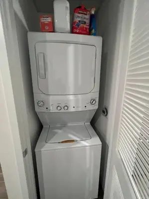 a white washer and dryer in a bathroom at Luxe Corner One Bedroom, Prime Hollywood with Parking in Los Angeles