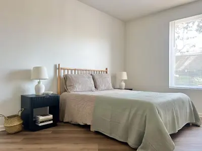 a bedroom with a bed with two night stands and two lamps at Big 3BD 2BA Apt with Pool and Gym near Venice Beach in Los Angeles