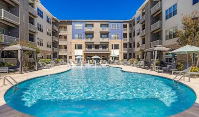 a swimming pool in front of a apartment building at Big 3BD 2BA Apt with Pool and Gym near Venice Beach in Los Angeles