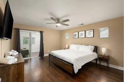 a bedroom with a bed and a ceiling fan at Perfect Home for Work or Relaxing Vacation in Bakersfield