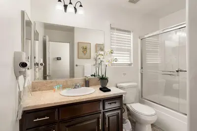 a bathroom with a sink and a toilet and a shower at Perfect Home for Work or Relaxing Vacation in Bakersfield