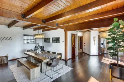 a dining room with a wooden table and chairs at Lake Arrowhead Cabin 4 Decks, Game Room and More! in Lake Arrowhead
