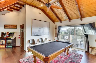 a pool table in a room with a ceiling at Lake Arrowhead Cabin 4 Decks, Game Room and More! in Lake Arrowhead