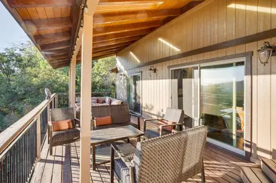a porch with chairs and a couch on it at Lake Arrowhead Cabin 4 Decks, Game Room and More! in Lake Arrowhead