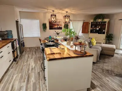 a kitchen and living room with a counter top at The Coastal Comfort in Oxnard