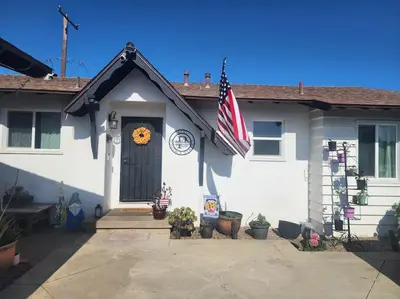a house with an american flag on the front door at The Coastal Comfort in Oxnard