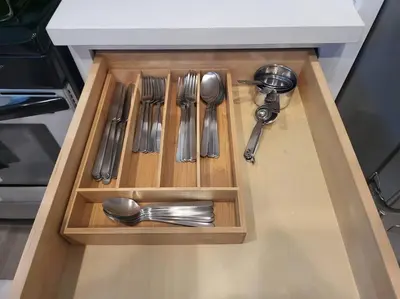 a drawer with silver utensils in a kitchen at High Desert Dream on the Fairway WiFi Smart TVs in Victorville