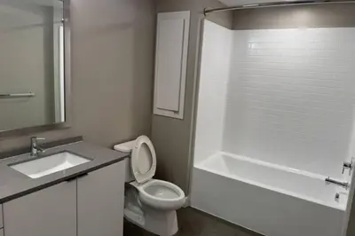 a bathroom with a sink and a toilet and a bath tub at Spacious and Modern 3 bedroom 2 unit in Los Angeles