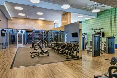 a gym with rows of treadmills and machines at Spacious and Modern 3 bedroom 2 unit in Los Angeles