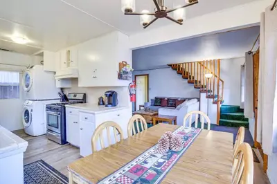 a kitchen and dining room with a table and chairs at The Twin Pines Chalet, 2 min to Village, BBQ in Big Bear Lake