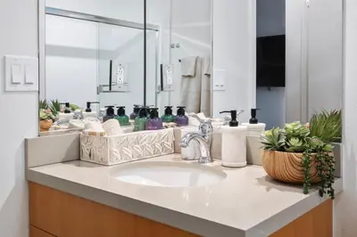 a bathroom counter with a sink and a mirror at 14 Santa Monica Gorgeous Apartment in Los Angeles