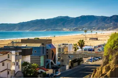 a view of a beach with buildings and the ocean at 14 Santa Monica Gorgeous Apartment in Los Angeles