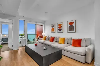 a living room with a couch and a table at Modern & chic in Heart of Downtown Santa Monica in Los Angeles