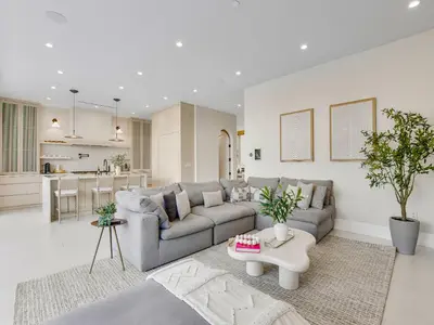 a living room with a couch and a table at Villa Camellia in Los Angeles